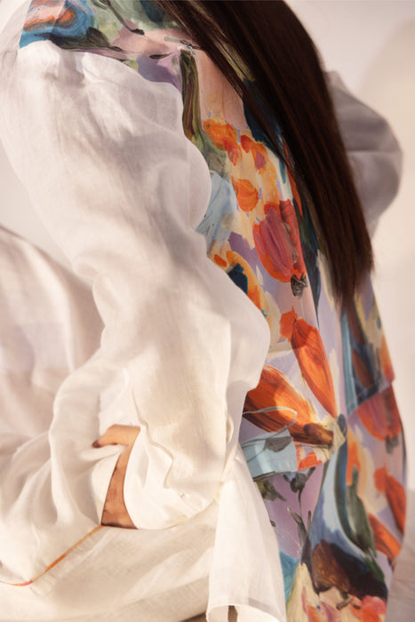 Millefleur Co-ord Set - Close-up of white linen shirt back with colorful floral print, worn with elasticated trousers - NJ3ATELIER co-ord set