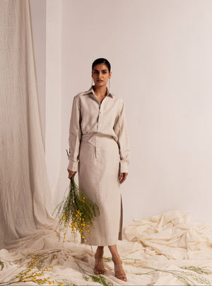 Elegant linen coord set with a classic collared shirt, full sleeves, and a pencil skirt featuring side slits, showcasing luxury womenswear craftsmanship