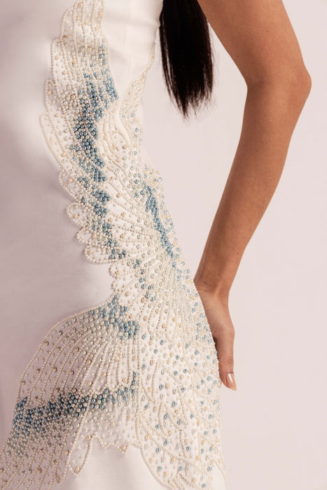 Sea Shell Pearl Dress detail - Close-up of hand-embroidered crane design with shell pearls on white hosiery fabric - NJ3ATELIER luxury formal wear