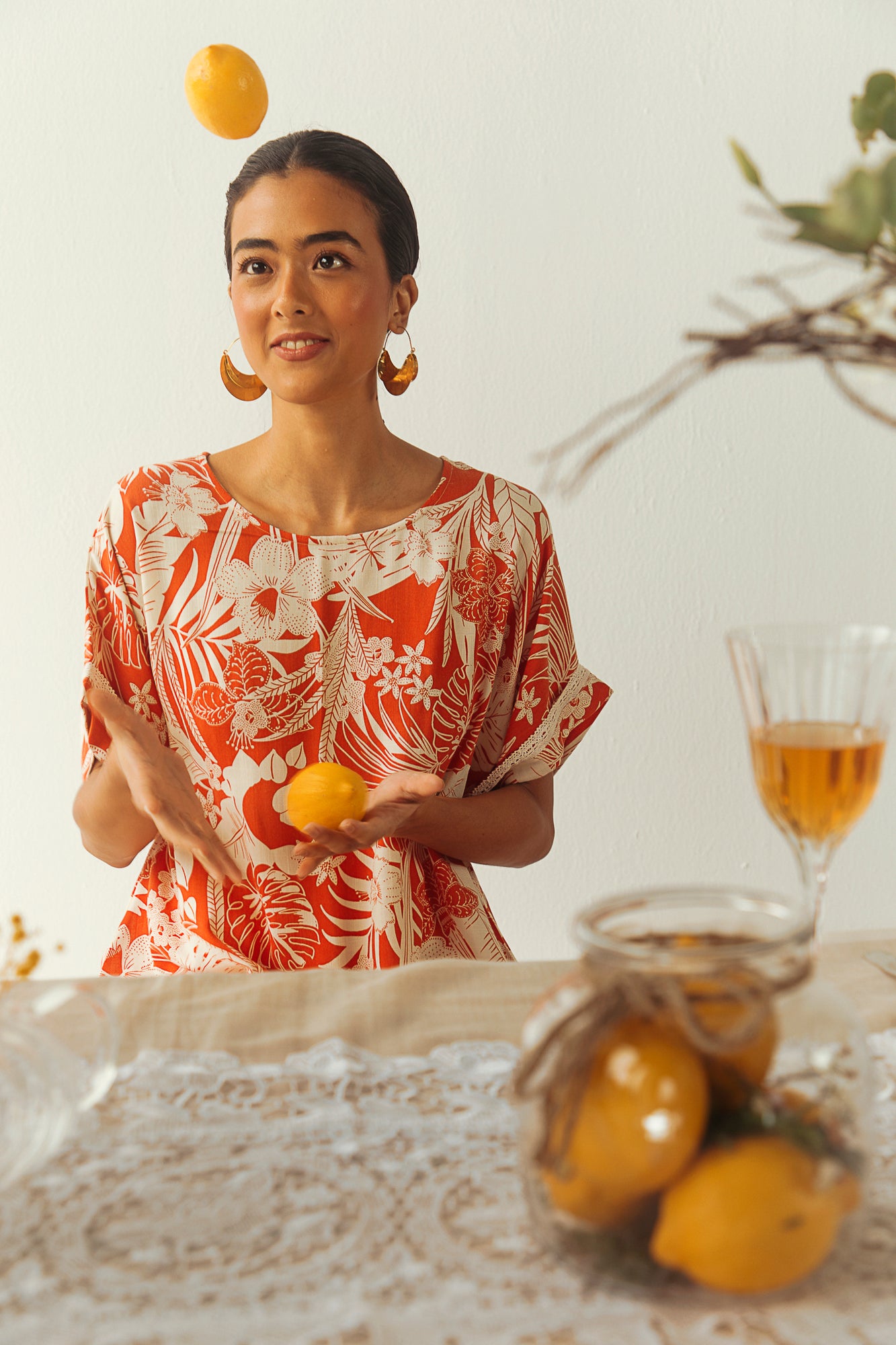 Handcrafted orange and white tropical printed top with half dolman sleeves, made from up-cycled pure viscose, exuding luxury and elegance