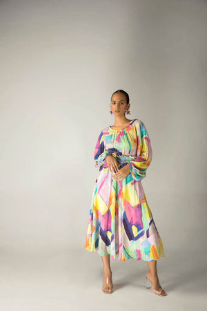 Elegant long dress in multi-color crepe silk, featuring a smocked base; a luxury womenswear piece, dry clean only