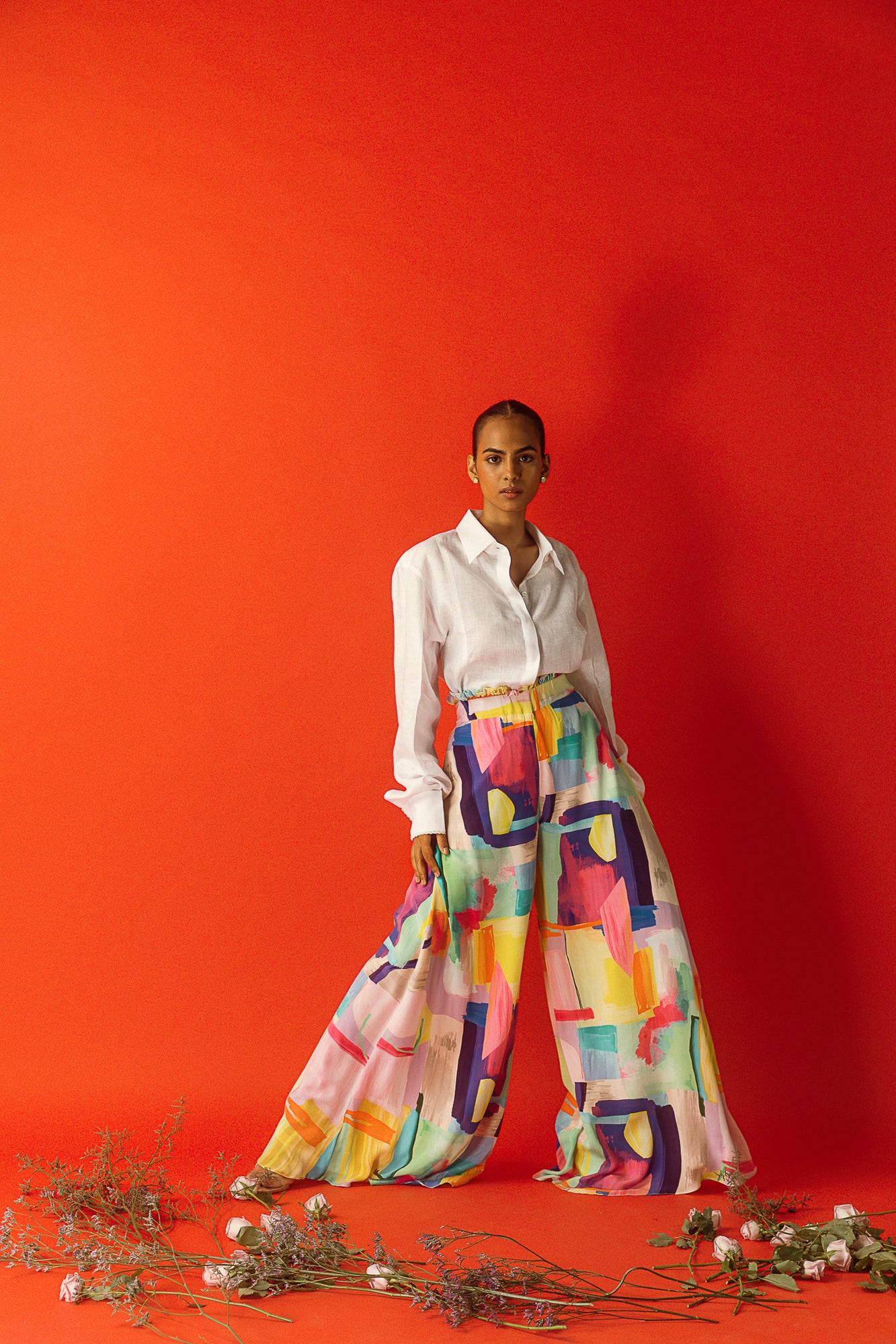 Handcrafted wide-leg palazzo pants in multi-colour crape silk with a waist ruffle, showcasing luxury womenswear elegance