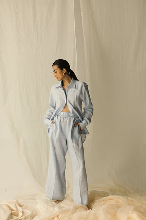 Baby blue full sleeve cotton shirt with scallop hem, featuring intricate embroidery on collar and cuffs, exemplifying luxury womenswear