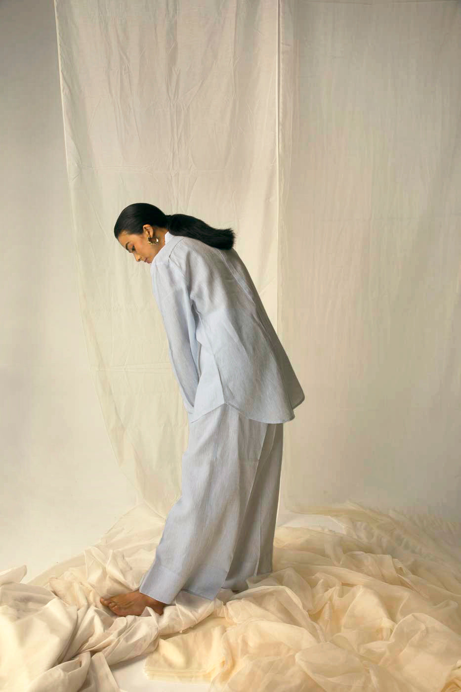 Elegant ivory scallop-hem shirt in premium handloom fabric, showcasing artisan craftsmanship and luxury womenswear style