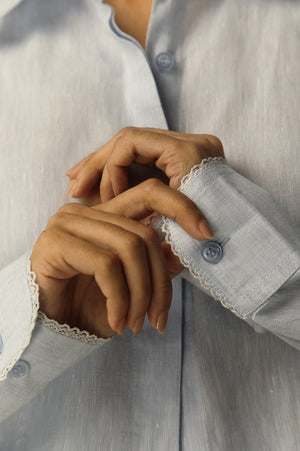 Close-up of the artisan-crafted scallop hem on a luxurious handloom shirt, showcasing premium fabric and elegant design details