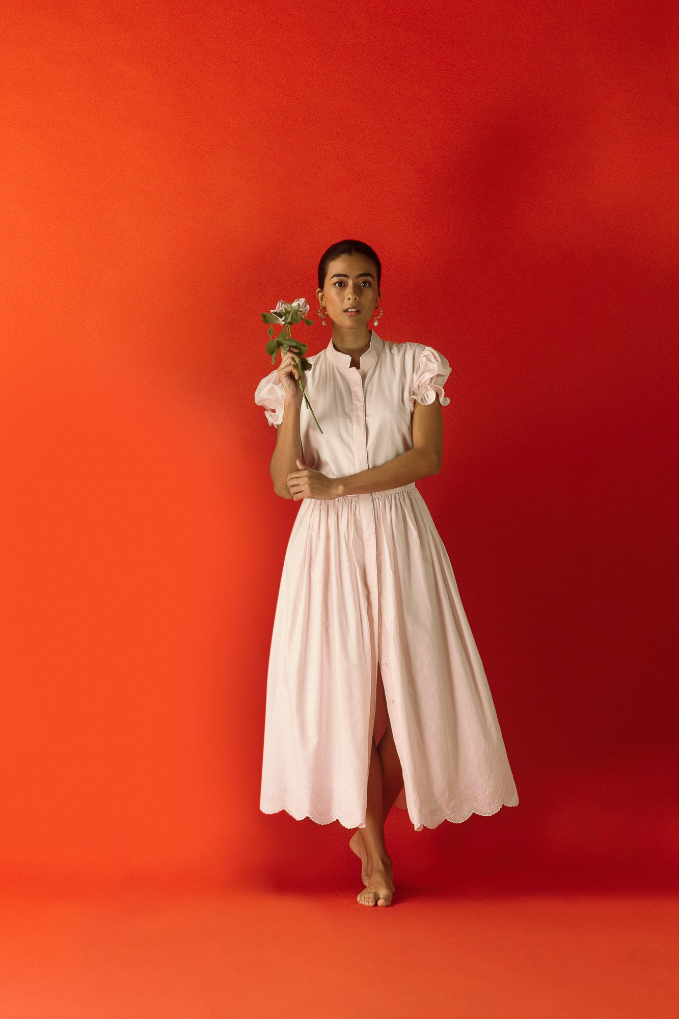 Luxurious pink dress in premium fabric, showcasing elegant handloom craftsmanship and sophisticated silhouette, embodying NJ3 Atelier's artisan luxury