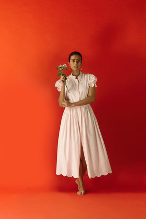 Luxurious pink dress in premium fabric, showcasing elegant handloom craftsmanship and sophisticated silhouette, embodying NJ3 Atelier's artisan luxury