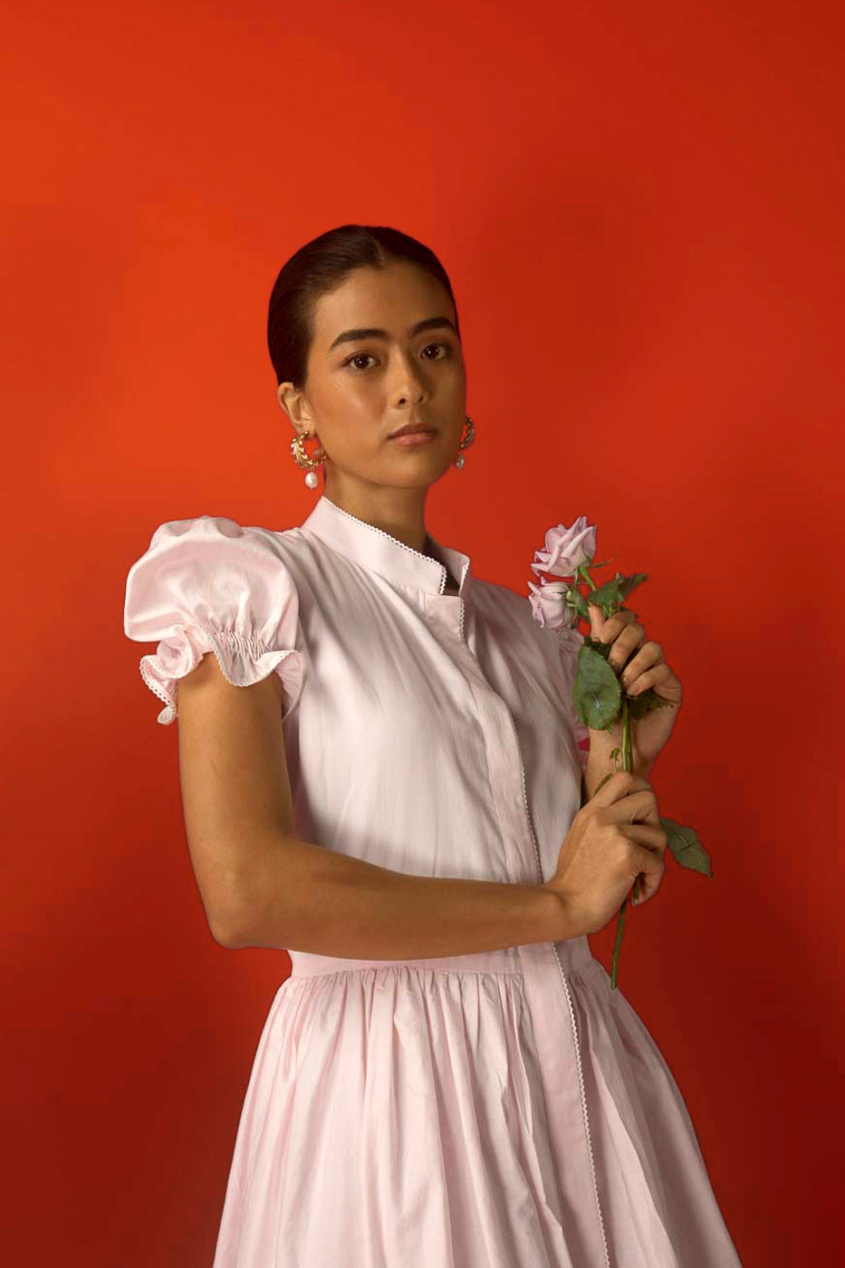 Luxurious pink long dress in pure Italian cotton, featuring elegant puff sleeves and a scalloped hem, embodying timeless artisan craftsmanship