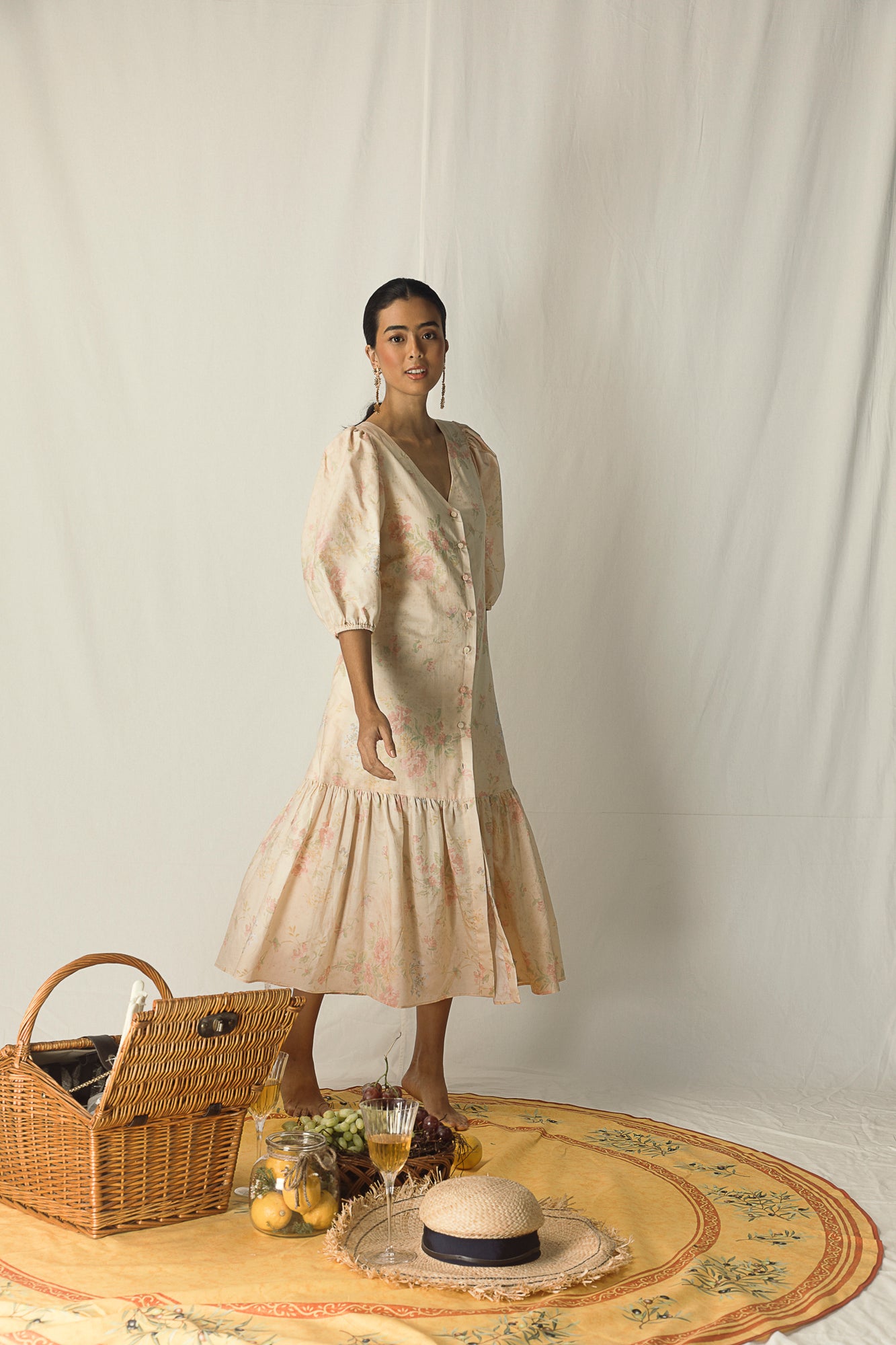 Yellow printed midi dress in premium Paris linen, featuring a V-neck and peasant elastic sleeves, showcasing luxury womenswear craftsmanship