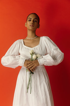 Elegant Bianca Cotton Midi Dress in handloom fabric, showcasing a refined silhouette and artisan craftsmanship for luxury womenswear