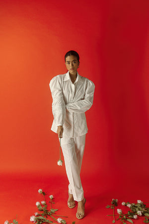White Italian linen shirt with intricate lace detailing on princess line and cuffs, showcasing luxury womenswear craftsmanship