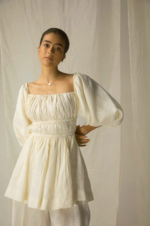 Luxurious short ruffled top in vibrant yellow Italian linen, featuring distinctive Ball sleeves; artisan-crafted for elegant womenswear
