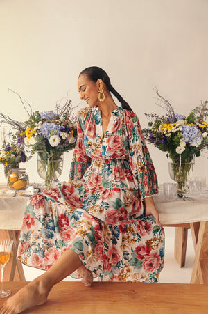 Elegant silk midi dress with bell sleeves, featuring a vibrant rose print in blue, red, pink, and green; artisan-crafted luxury