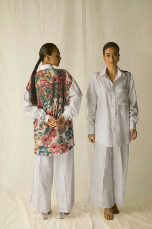 Luxurious white linen shirt with vibrant multicolored crepe silk back, showcasing artisan craftsmanship and premium womenswear elegance