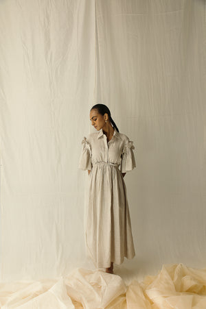 Luxury oyster grey dress with pleated sleeves, ruffled elastic base, crafted from pure Italian organic fabric, perfect for elegant occasions