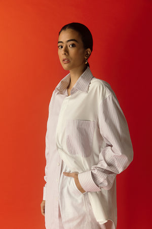Elegant women's shirt in pure Italian cotton, featuring a unique half pink stripe and half plain white design, exuding luxury and style