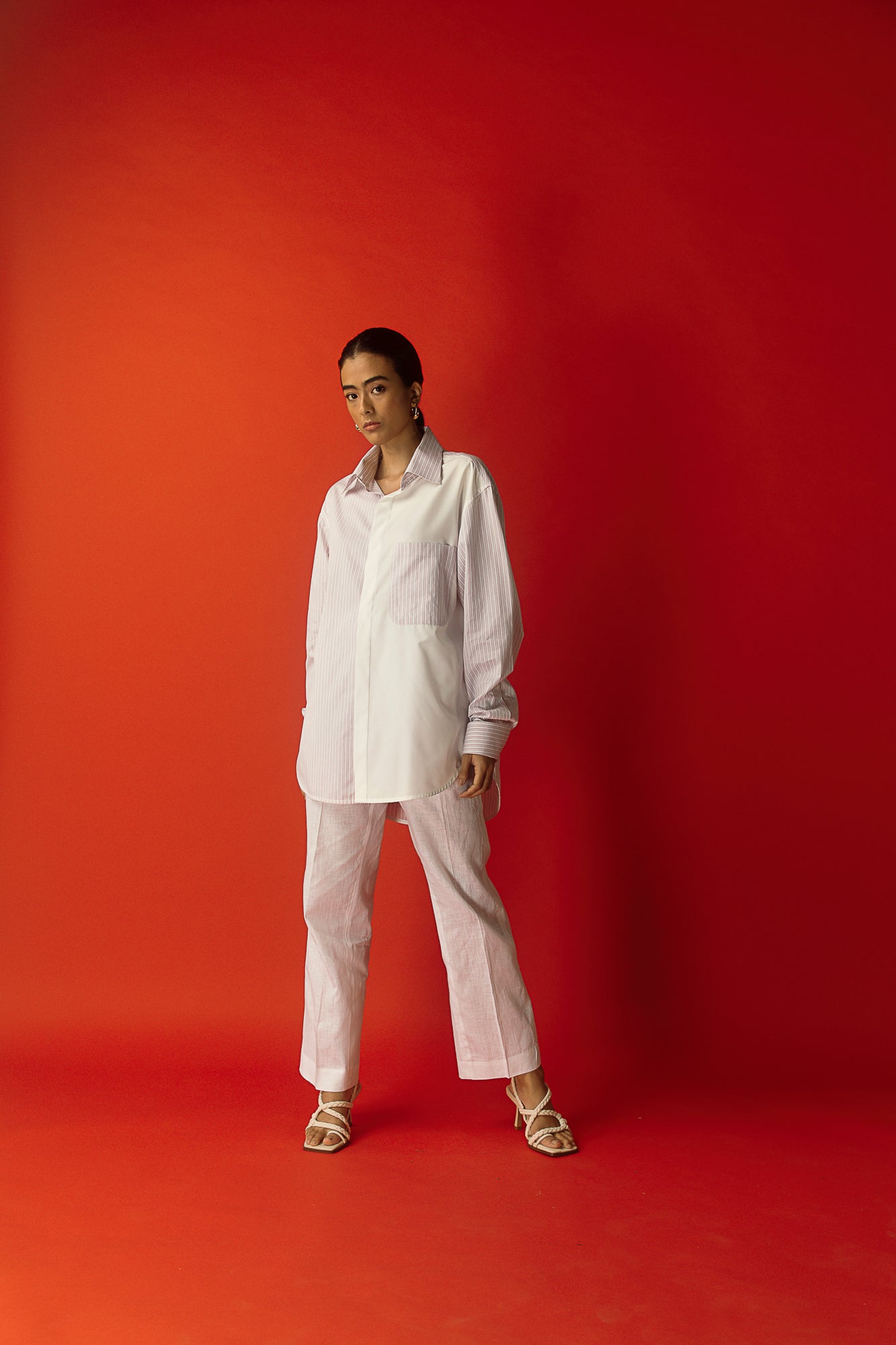 Mauvelous pink stripe shirt in premium handloom fabric, showcasing a tailored silhouette and artisan craftsmanship for luxury womenswear
