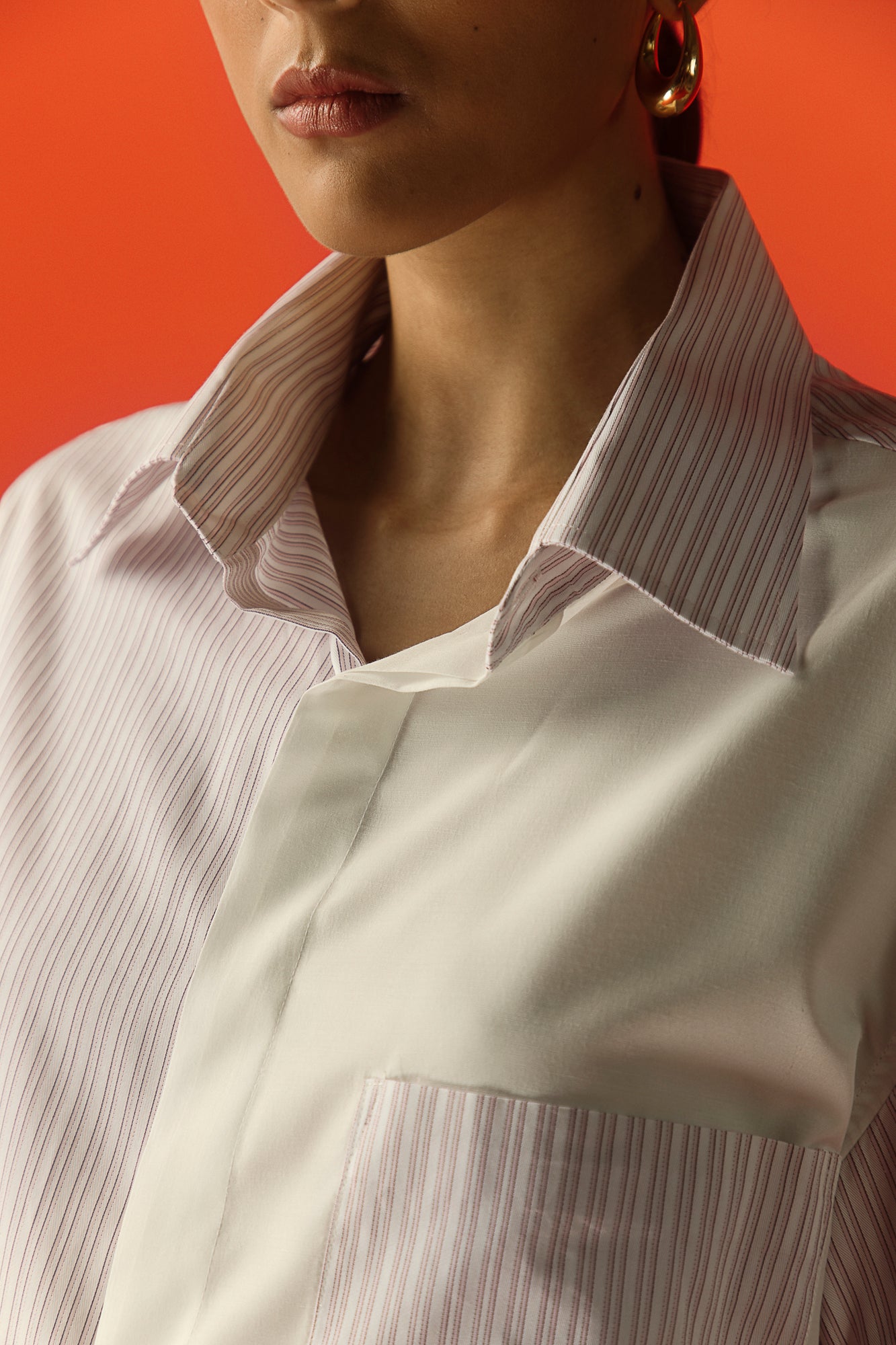 Close-up of mauve pink stripe shirt in premium handloom fabric, showcasing luxury craftsmanship and elegant design for women