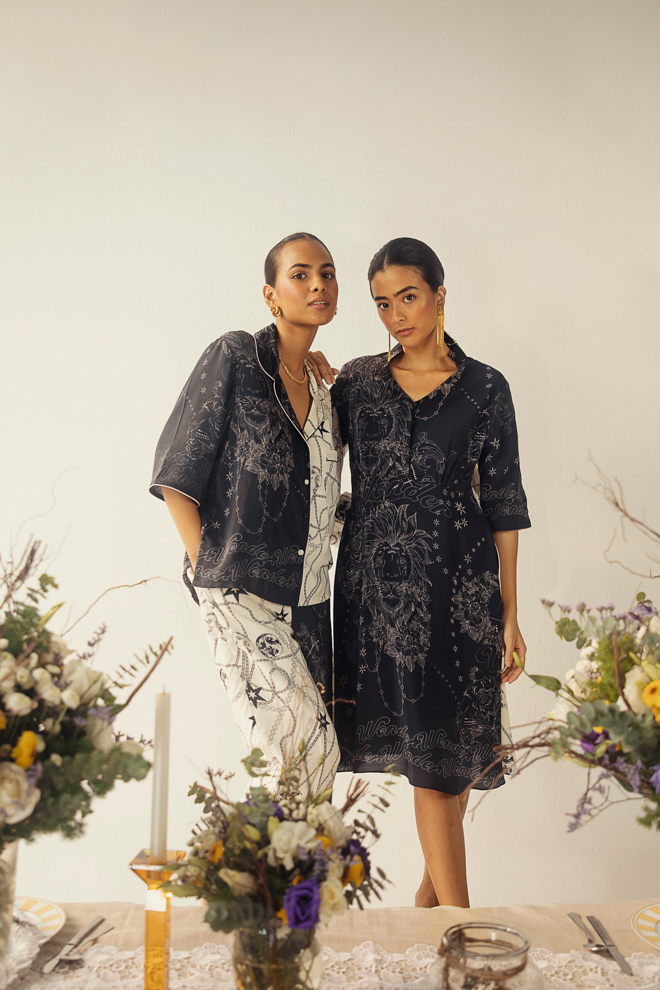 Luxurious black and white midi dress in pure crape silk, showcasing a sophisticated half-and-half design, artisan-crafted for elegance