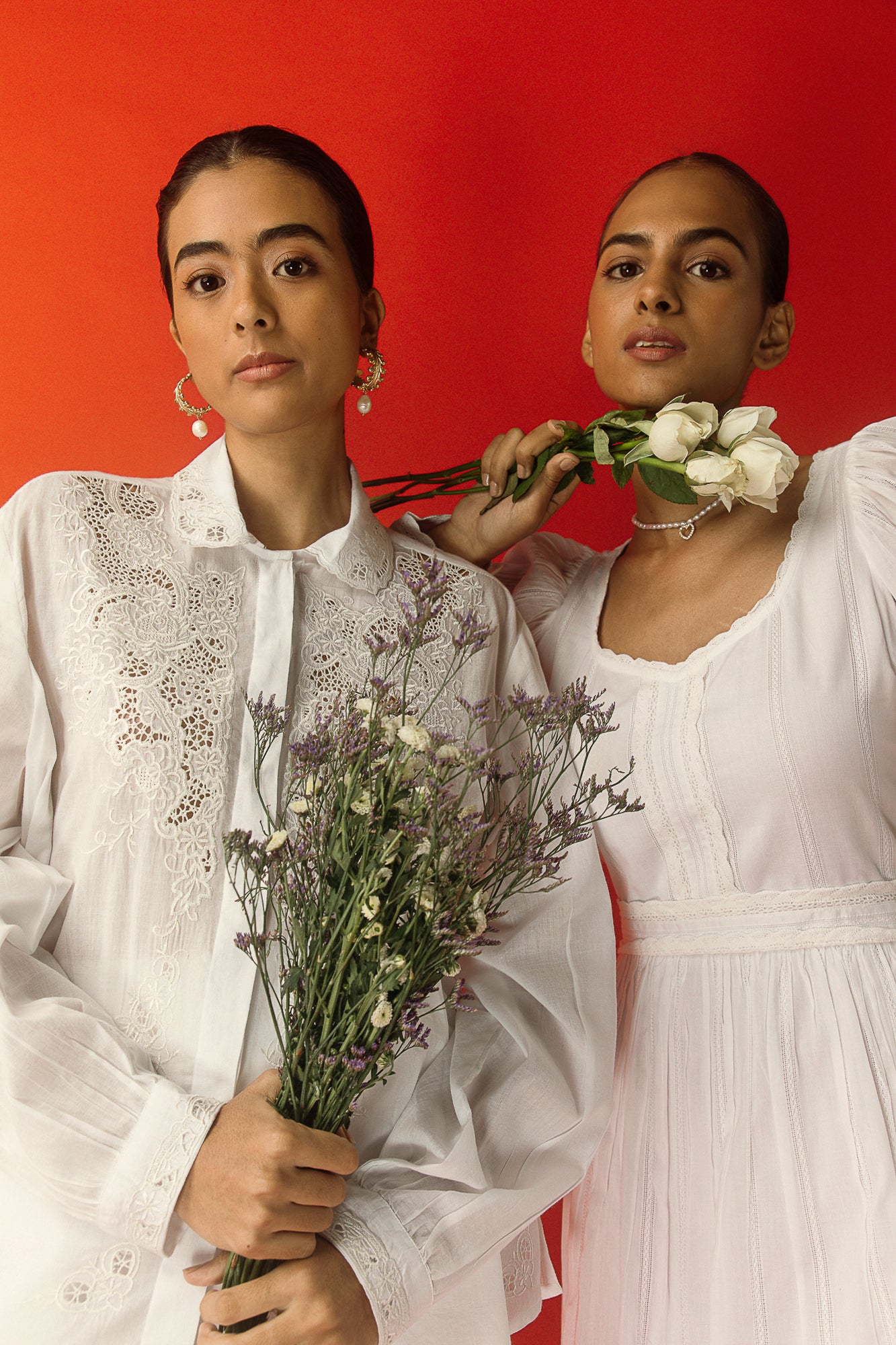 Elegant white handloom shirt with intricate artisan embroidery, showcasing premium mulmul fabric and sophisticated women's luxury style