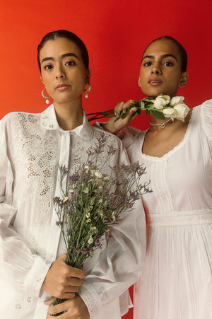 Elegant white handloom shirt with intricate artisan embroidery, showcasing premium mulmul fabric and sophisticated women's luxury style