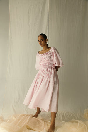 Luxurious pink ball dress in pure Italian linen, featuring front and back pleats with an elastic waist, exuding elegance and sophistication