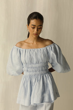 Elegant sky-blue top with a chic silhouette, crafted from premium handloom fabric, epitomizing luxury womenswear by NJ3 Atelier
