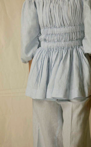 "Elegant sky blue top in premium handloom fabric, showcasing NJ3 Atelier's artisan craftsmanship and luxury womenswear design."