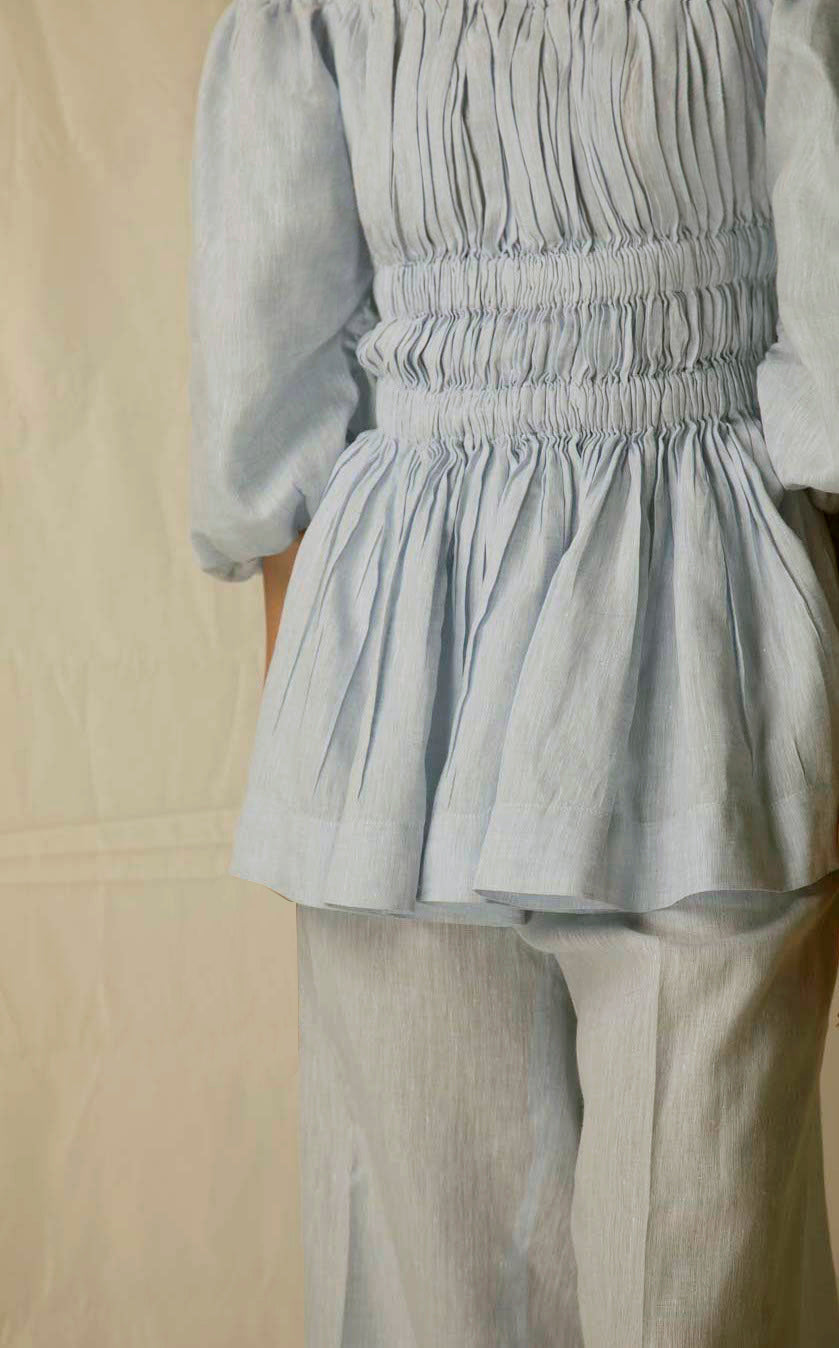 "Elegant sky blue top in premium handloom fabric, showcasing NJ3 Atelier's artisan craftsmanship and luxury womenswear design."