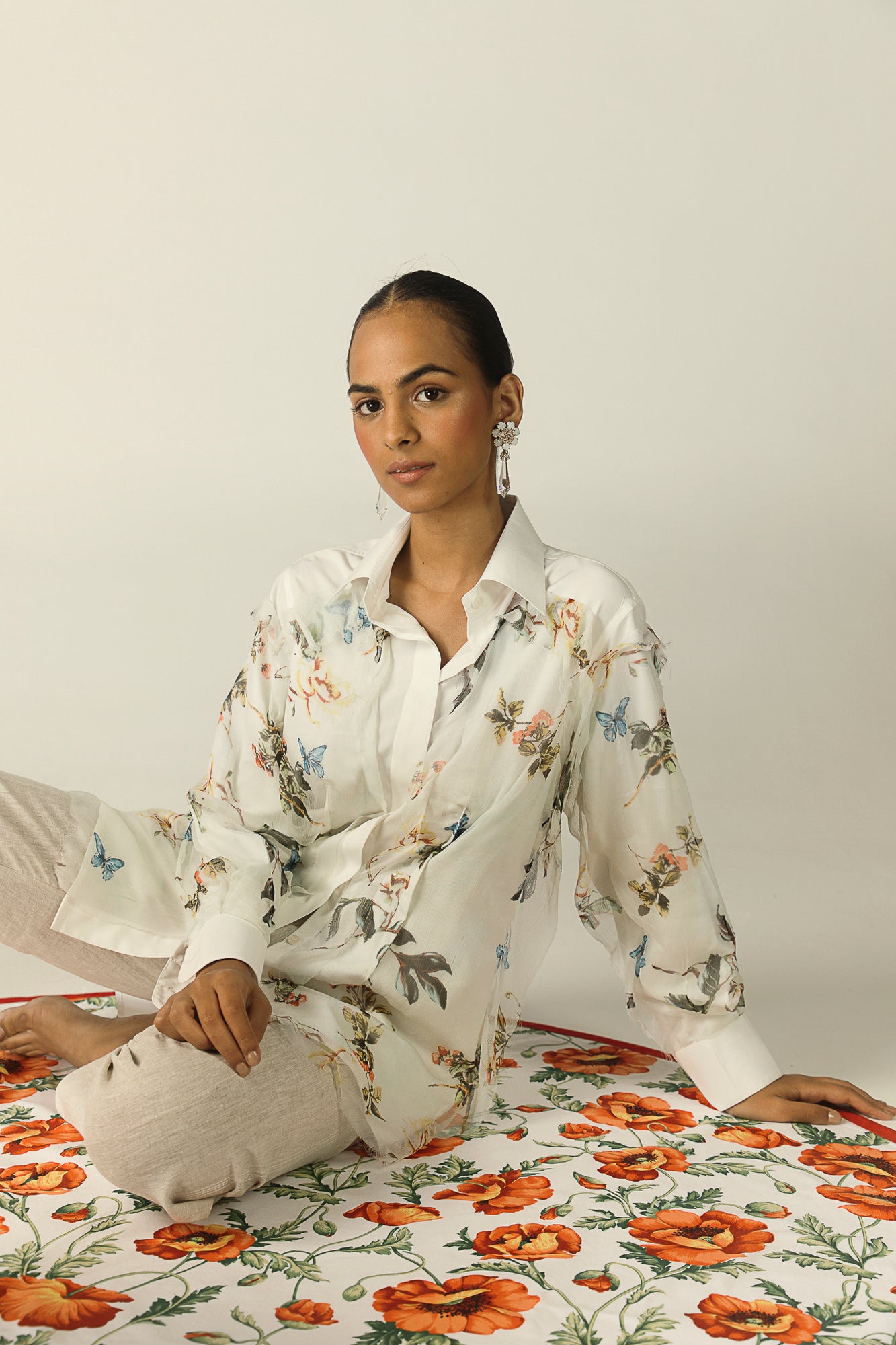 Elegant white cotton and chiffon shirt with blue and yellow accents, showcasing a luxurious, handcrafted design for sophisticated womenswear