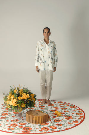 Elegant white shirt with butterfly split design, showcasing premium handloom fabric and artisan craftsmanship, embodying luxury womenswear